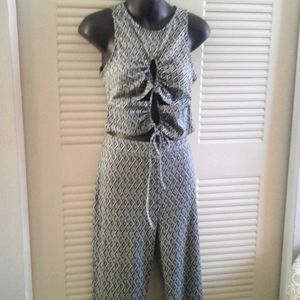 NWOT Like An Angel 2 Piece set. Flared Pant And Tank with Peek A Boo Areas Top